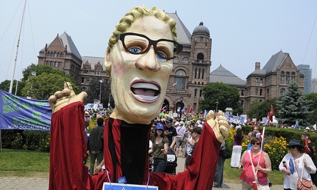 A puppet of Kathleen Wynne appears at the Queens Park Jobs, Justice and Climate Rally in Toronto.